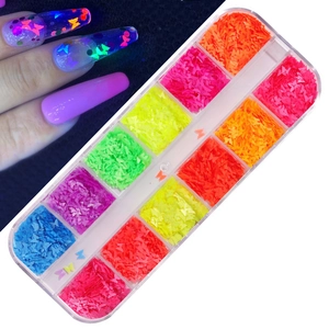 Detail of 12 colors butterfly nail art sequins with glow in the dark neon effect
