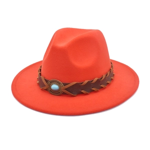 Detail of orange wool fedora featuring a woven brown band and turquoise stone ornament