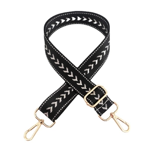 Adjustable nylon shoulder strap with silver arrow pattern and gold metal hardware