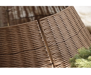 Close-up of the handcrafted brown woven texture on a minimalist Christmas tree stand base