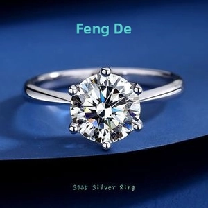 Macro view of a classic six-prong S925 sterling silver ring with a round moissanite stone
