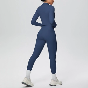 Detail view of navy blue high-stretch yoga set featuring slim fit long sleeve crop top and leggings