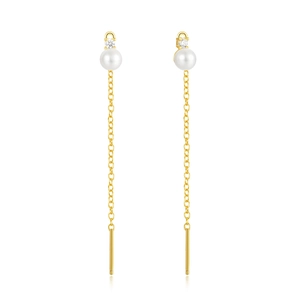 Macro detail of 925 silver gold pearl tassel earrings with fine cubic zirconia stones