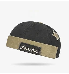 Detail of vintage washed docker hat showing the star patch and two-tone stitching