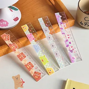 Set of four 15cm transparent cartoon rulers with cute animal prints on a wooden tray