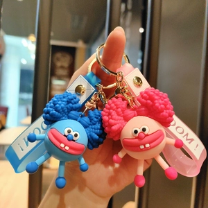 Funny cartoon monster silicone keychain in blue and pink with BOOM! wrist strap