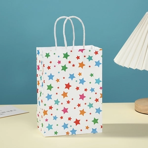 Eco-friendly white paper gift bag with colorful star prints and white rope handles