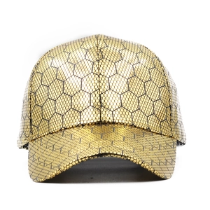 Metallic gold baseball cap with black honeycomb pattern and standard curved brim