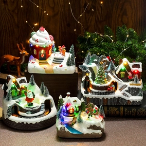 Luminous Christmas resin music box with rotating train, snow scene and LED lights
