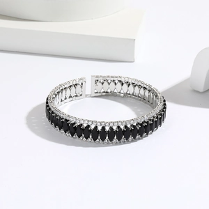 Elegant silver-tone bangle with black marquise zircons and micro-paved white crystals
