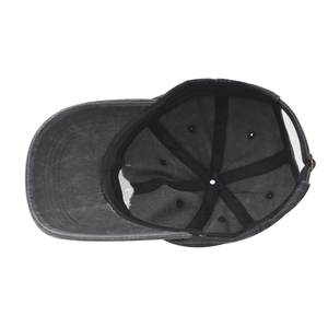 Detailed interior of a vintage grey washed cotton baseball cap with adjustable metal buckle