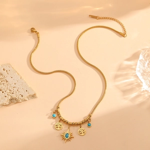 Gold plated stainless steel snake chain necklace with turquoise sun and tree of life charms
