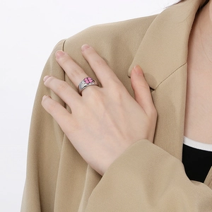 Fashionable stainless steel ring with pink lucky clover design on a silver band for women