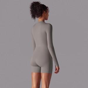 Back view of gray long-sleeve fitness bodysuit showing sleek fit and premium fabric texture