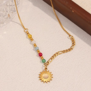 Close-up of 18K gold-plated sun pendant necklace with natural stone and colorful beads