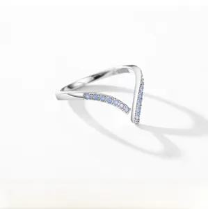 Macro view of V-shaped S925 sterling silver ring with light blue zircon stones