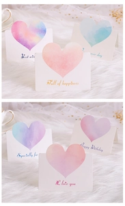 Detailed view of six watercolor heart greeting cards with English blessings and gold stars