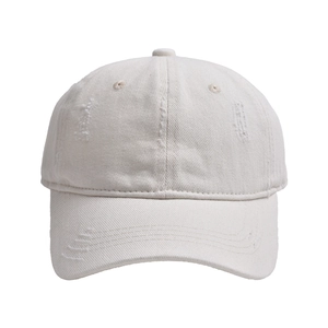 Distressed cream baseball cap with ripped details and vintage washed cotton finish