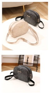 Detailed view of Sunnycity leather crossbody bags in beige and black with gold logo