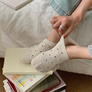 Beige polka dot invisible boat socks showing elastic ribbed cuffs and premium cotton knit