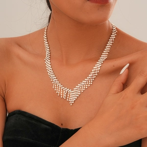 Close-up of sparkling diamond tassel necklace with elegant V-shaped layered fringe