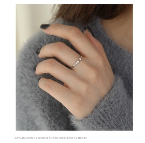 Detailed close-up of a silver cat paw hug ring with sparkling cubic zirconia crystals