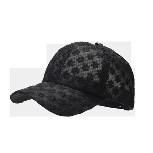 Detail of black hollow lace fabric with exquisite floral embroidery on a baseball cap