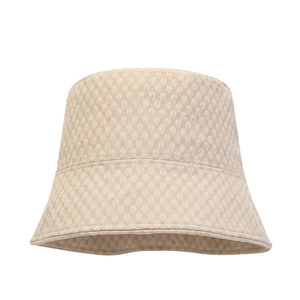 Classic beige sun bucket hat with textured fabric design and foldable brim for women