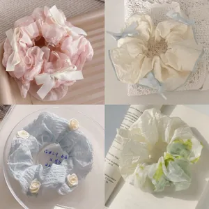 Chiffon scrunchies set with ribbons and floral patterns for a sweet balletcore hair style