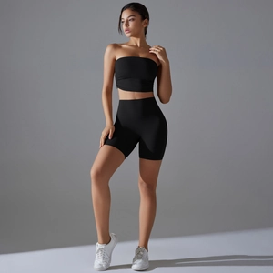 Close-up of black strapless crop top and high-waisted slimming yoga shorts set