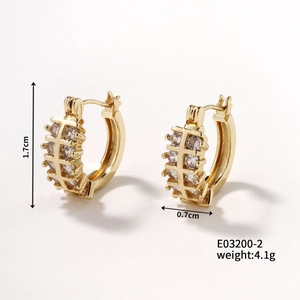 Macro shot of gold checkered hoop earrings with dimensions 1.7cm by 0.7cm and zircon inlay