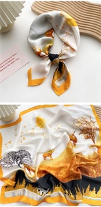 Detail of silk scarf with sunset landscape print and animal silhouettes