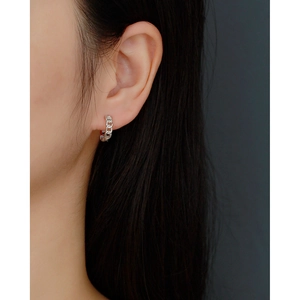 Close-up of minimalist S925 sterling silver chain link hoop earring on female model