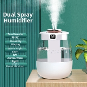 Macro detail of white dual mist humidifier featuring digital humidity display screen