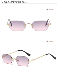 Detalle de gafas de sol octogonales sin montura con marco dorado y lentes de color rosa