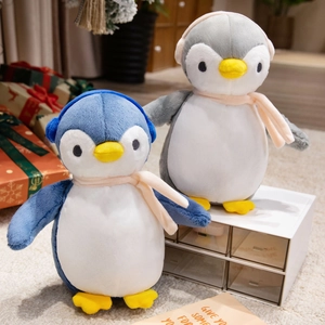 Cute plush penguin dolls in blue and grey wearing pink scarves and earmuffs for gifts