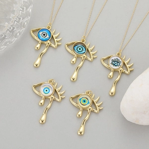 Vintage gold teardrop evil eye pendants with colorful enamel details on gold chains