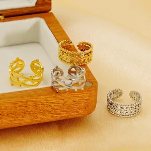 Set of 4 geometric 18k gold and silver plated rings with laurel leaf and branch designs