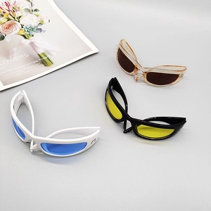Three pairs of Y2K wraparound sports sunglasses in white, black, and champagne frames