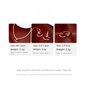 Detail of red enamel horse jewelry set with synthetic pearls and white zircons