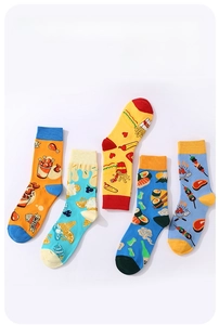 Detailed view of five pairs of cotton socks with vibrant food themed patterns