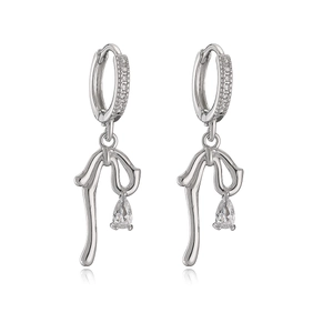 Elegant silver bow earrings with teardrop cubic zirconia pendants on white background