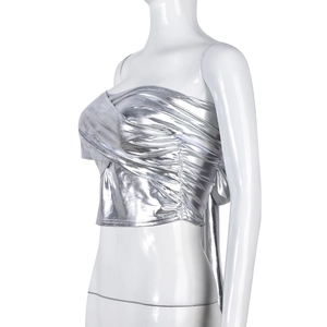 Close-up of silver reflective crop tube top showing pleated details and metallic texture