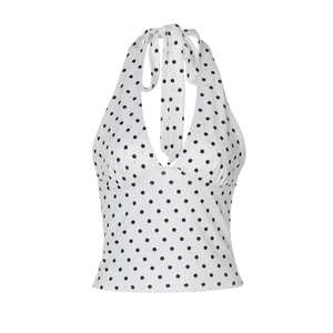Detailed view of white and black polka dot halter neck top with tie-back strings
