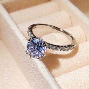 Macro view of classic S925 silver ring featuring round zircon and four-prong setting