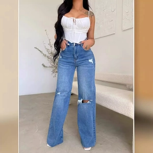 Women's high waist ripped wide leg jeans paired with a white drawstring crop top