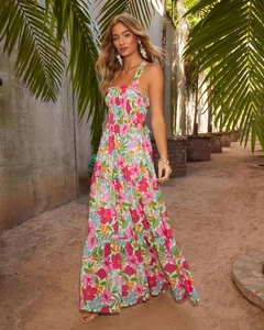 Close-up of vibrant floral print and elastic smocked bodice on summer maxi dress