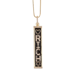 Close-up of rectangular 18K gold pendant with RICH lettering and black enamel finish