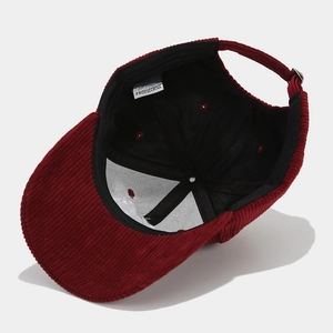 Detailed interior view of corduroy baseball cap with 100% cotton label and stitching
