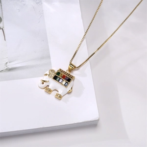 Detailed close-up of elephant pendant with colorful zircons on a golden chain necklace